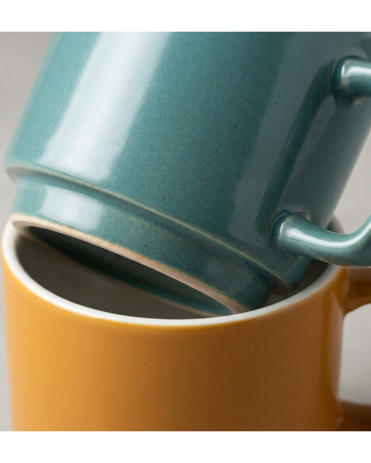 Dpfkl Two Pack Ten Ounce Stackable Ceramic Mugs Ochre and Teal - Detail view
